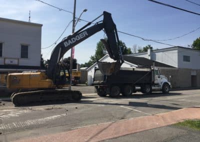 Road work with the hy-hoe and truck